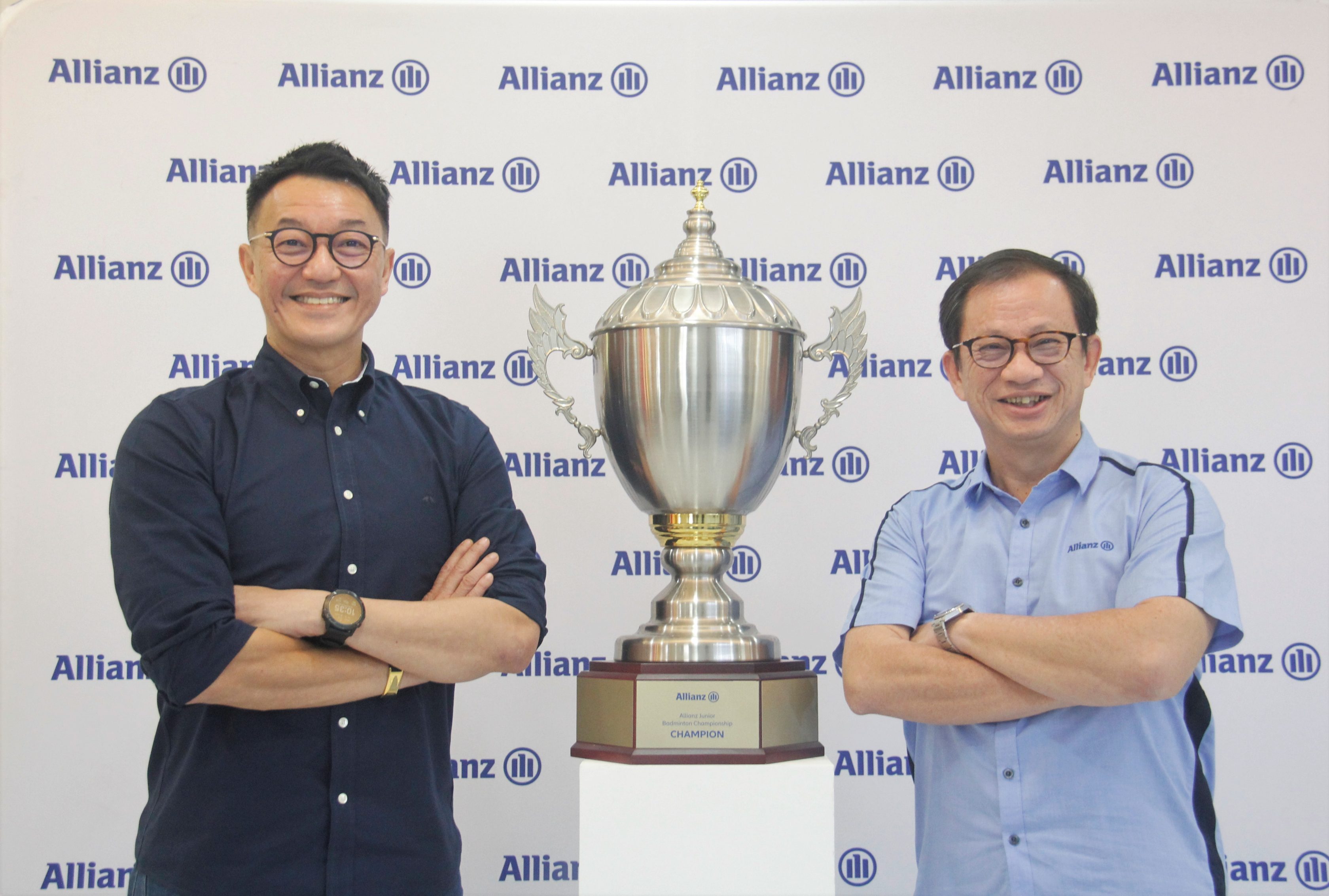 Allianz Malaysia Berhad Chief Executive Officer Sean Wang (left) and Allianz Life Insurance Malaysia Berhad Chief Executive Officer Charles Ong with the inaugural Allianz Junior Badminton Championships challenge trophy.